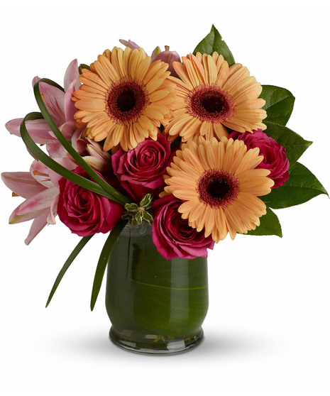 colorful flowers in hurricane glass