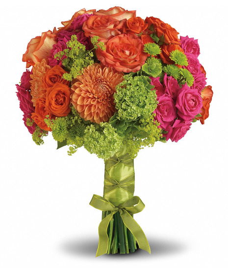colorful flower arrangement with dahlias, hydrangeas, roses, and more in shades of orange and hot pink