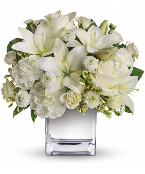 white floral arrangement in cube
