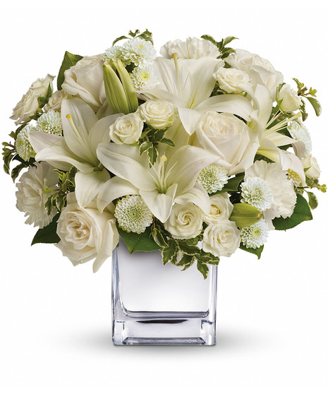 white floral arrangement in cube