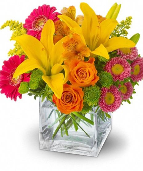 colorful floral arrangement in yellow, orange, and pink