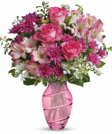pink floral arrangement in dramatic vase
