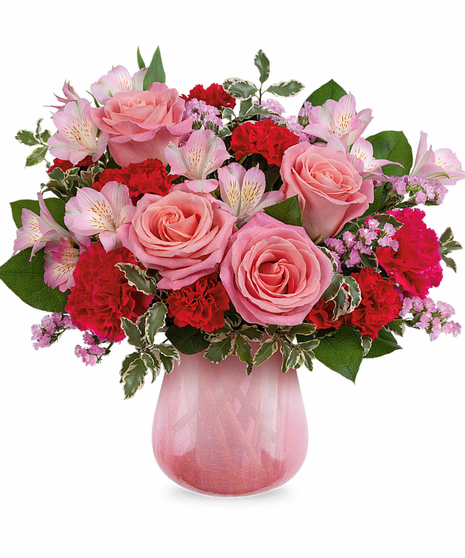 pink floral arrangement in dramatic vase